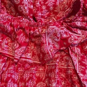 Red off the shoulder dress, medium-short.
